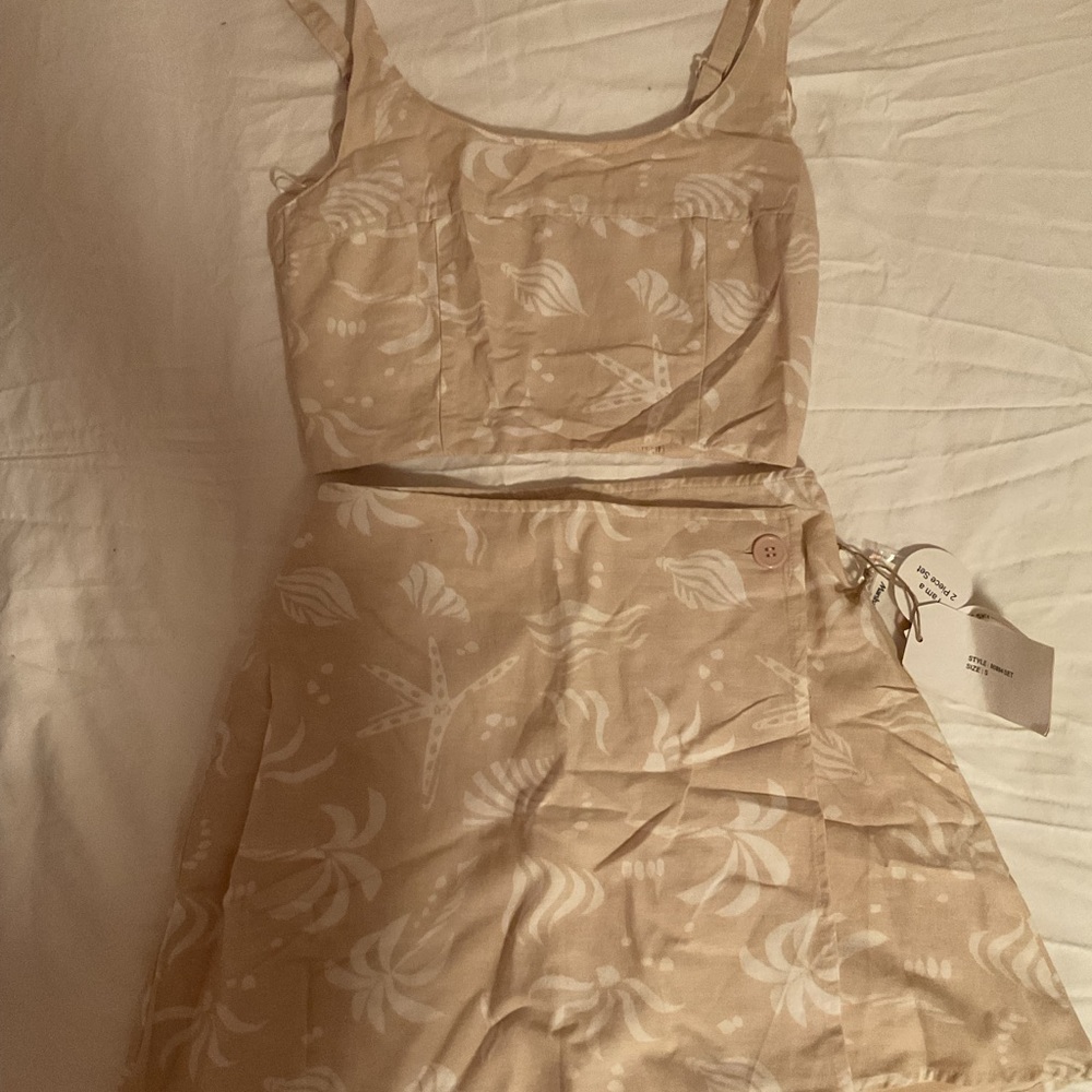 Beige Sleeveless Dress with White Pattern